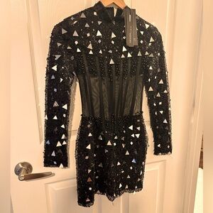 Sleek cocktail. Sheer with silver embellishment. Runs small. Tight fitting